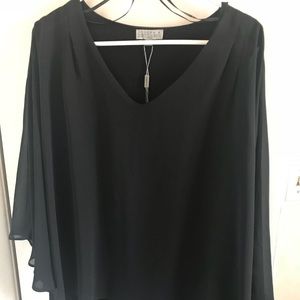 Sheer cape, sleeveless under top with v neck